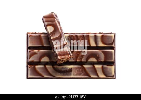 Bar of Zebra dark & white Kitkat Kit-Kat Kit Kat removed from wrapper with one finger started and positioned on top Stock Photo