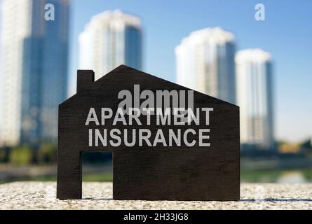 Apartment insurance concept. Model of home on the surface. Stock Photo