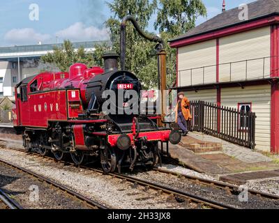 Ivatt Class 2-6-2T steam loco on the Keighley & Worth Valley Railway takes on water at Keighley station. Stock Photo