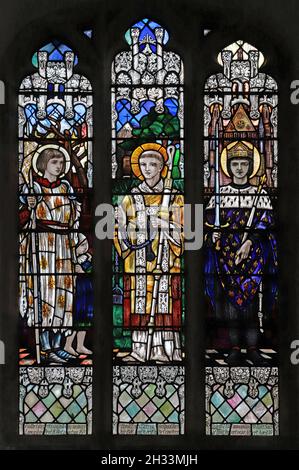 A stained glass window by Christpher Whall Studios 1920 depicting French Saints, St Leonard's Church, Apethorpe, Northamptonshire Stock Photo