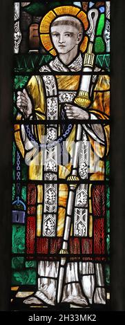 A stained glass window by Christpher Whall Studios 1920 depicting French Saint Leonard, St Leonard's Church, Apethorpe, Northamptonshire Stock Photo