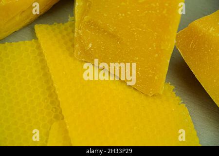 large pieces of natural beeswax, close-up, raw materials for candles Stock Photo