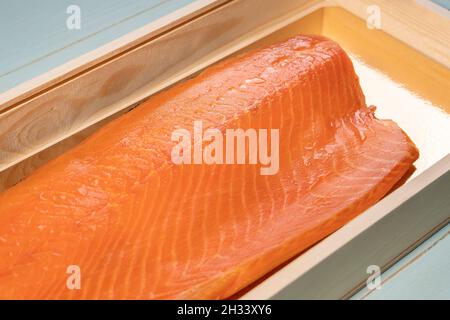 Smoked wild sockeye salmon inside wooden box Stock Photo