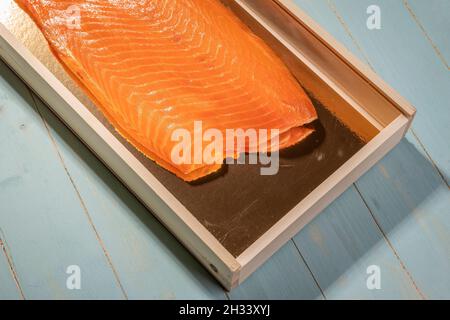 Smoked wild sockeye salmon inside wooden box Stock Photo