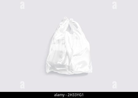 Blank white die-cut small plastic bag with handle hole mockup Stock Photo -  Alamy