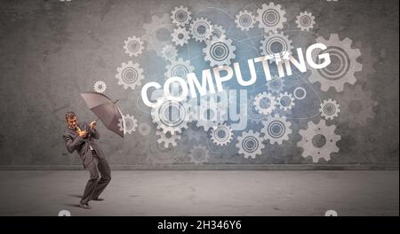 Businessman defending with umbrella concept Stock Photo