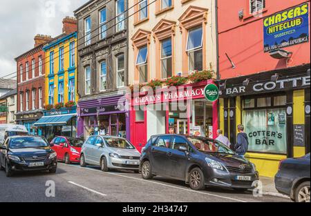 Skibbereen, County Cork, Republic of Ireland.  Eire.  Colourful shop fronts on Main Street. Stock Photo