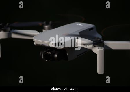 A dji mini 2 drone in action in jena at autumn, copy space Stock Photo