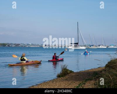 group of Middle aged people kayaking on the Christchurch Harbour, Dorset, UK Stock Photo