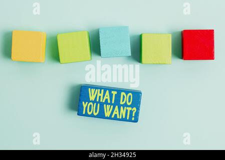 Handwriting text What Do You Want Question. Word Written on say or write in order to ask person about something Stack of Sample Cube Rectangular Boxes Stock Photo