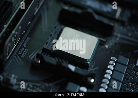 AMD Ryzen processor installed in motherboard slot AM4 closeup Stock Photo