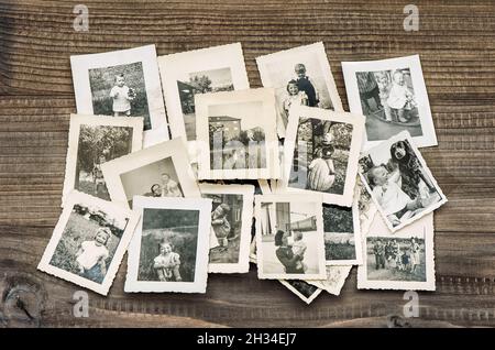 Vintage pictures old family photos on wooden table background Stock Photo