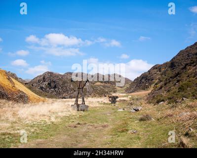 The remains of pylons from past copper mining activities in Cwm Bychan, near Beddgelert in Snowdonia National Park , Gwynedd, Wales Stock Photo