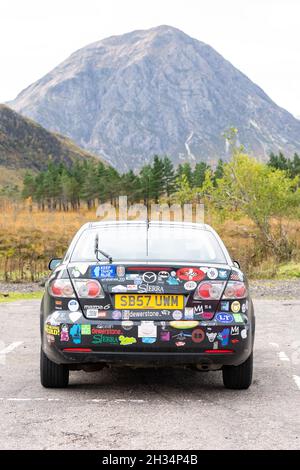 Car covered in stickers at Glencoe mountain resort, Glen Coe, Scotland, UK Stock Photo