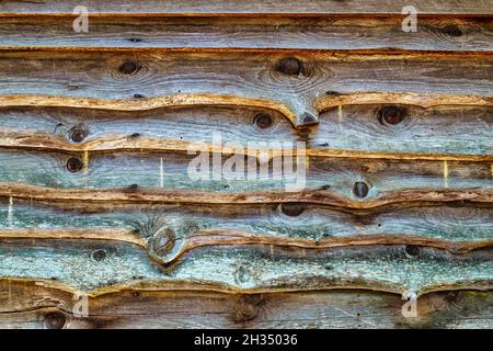Rough cut planks on a shed wall form a background at an outdoor sawmill in Morganton, North Carolina. Stock Photo