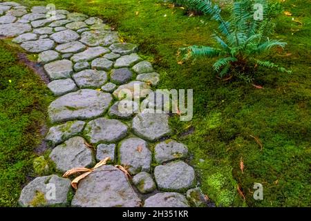 Stone pathway in the Seattle Japanese Garden, Seattle, Washington State, USA Stock Photo