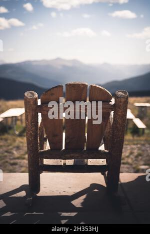 An empty rocking chair at the top of Vail Mountain in Colorado. Stock Photo