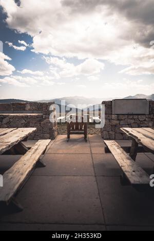 An empty rocking chair at the top of Vail Mountain in Colorado. Stock Photo