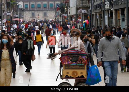 Non Exclusive: A person disguised  as skull at Cempasuchil Flower Fair and decorations at Reforma avenue as part of  the Day of the Dead celebrations. Stock Photo