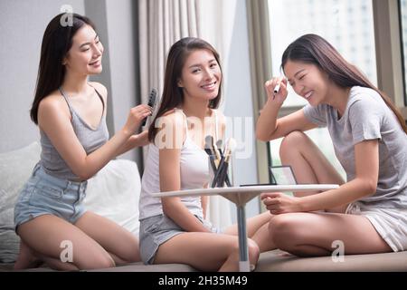 Three best friends making up together Stock Photo