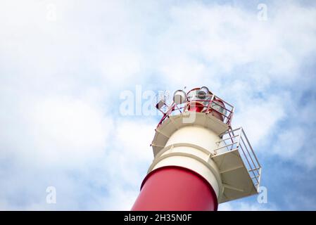 Lighthouse. Blue sky with clouds. Bottom view of the lighthouse Stock ...
