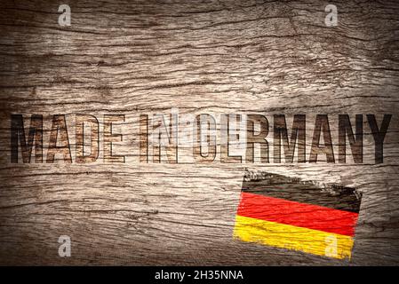 Slogan Made in Germany on a wooden background Stock Photo