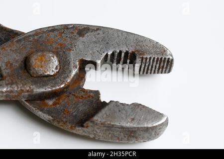 Old rusty pliers, old type of adjustable pincers which are still useful. Stock Photo