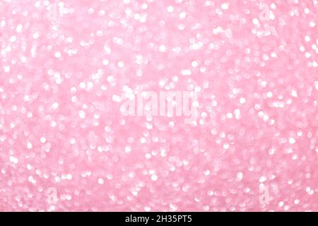 Defocused pink silver, pink rose bokeh,circle abstract light background, shining lights, sparkling glittering Valentines, women day,event lights romantic backdrop.Blurred abstract holiday background. Stock Photo