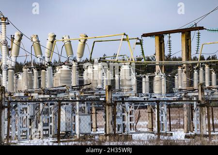 High voltage vintage electrical substation. Closeup on wiring, connections and insulators of a electrical substation. Stock Photo