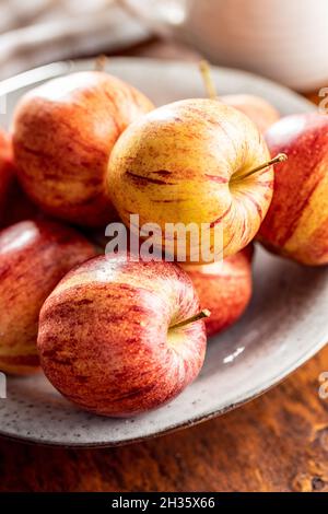 Fresh autumn apples on wooden table. Stock Photo