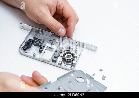 door lock inside. the lock is disassembled to detect breakage Stock Photo