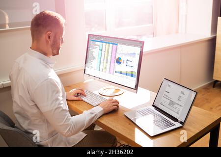 Spreadsheet Analyst Employee Worker. Medical Report On Computer Stock Photo
