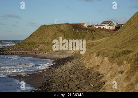 Hiking the coastal path of Lonstrup on a sunny and stormy day, Jammerbugt, Lonstrup, Hjorring, Northern Jutland, Denmark Stock Photo