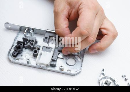 disassembled door lock, inside view. broken lock Stock Photo