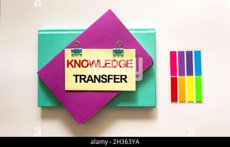 The Knowledge Exchange text is written on a sticker. Concept means deliberate exchange of information that helps in flexibility. Stock Photo