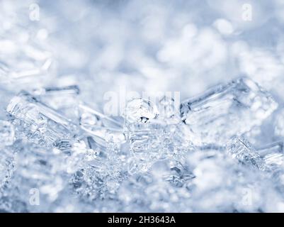 Broken ice cubes, winter background, texture of ice crystals. Frozen water. Stock Photo