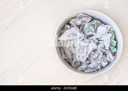 Used sales receipts prepared for recycling. Recyclable materials. Waste to be recycled. Free space. Stock Photo