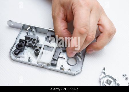 the magnetic latch in the door lock is broken. the lock was dismantled Stock Photo