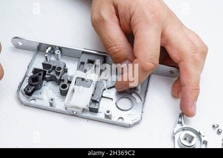 door lock inside. the lock is disassembled to detect breakage Stock Photo
