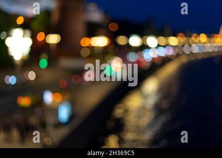 Bokeh effect from street lights and car at night. Stock Photo