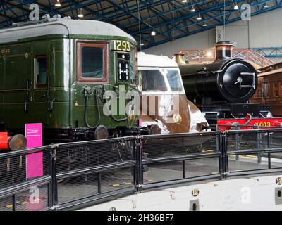 Southern Railway electric multiple unit from 1930's, a Great Western Rly diesel railcar and the GWR loco 4003 'Lode Star' in the NRM, York. Stock Photo