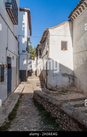 Narrow street in Albaycin neighborhood of Granada, Spain Stock Photo