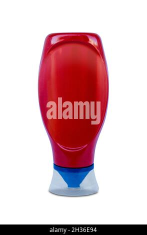 Red plastic bottle of ketchup isolated on white Stock Photo
