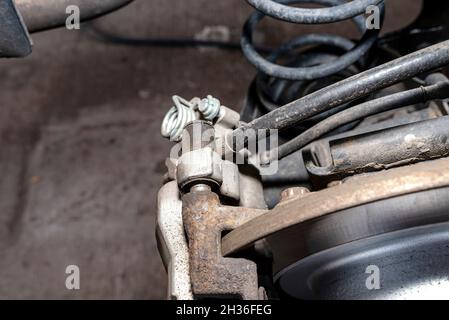 New rear brake calipers and brake discs with pads in a passenger car ...