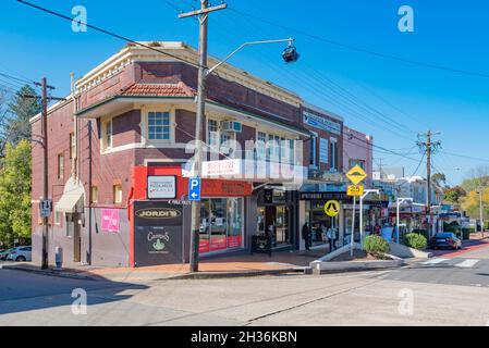 A two storey interwar brick building on the corner of the shopping strip on Grandview Lane and Grandview Avenue in Pymble, New South Wales, Austral Stock Photo
