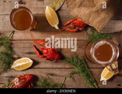 Crayfish boiled on a dish with dill spices and lemon. Stock Photo