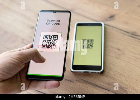 Scanning QR code with mobile smart phone. checking the qr code on the mobile phone. Stock Photo