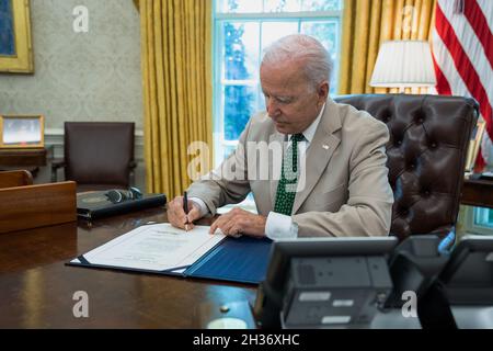 WASHIGNTON DC, USA - 06 August 2021 - US President Joe Biden signs the Debarment Enforcement of Bad Actor Registrants, or DEBAR Act of 2021, Friday, A Stock Photo