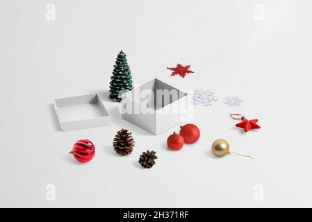 Making beautiful Christmas gift. Isometric composition with box, and Christmas decorations Stock Photo