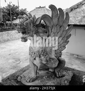 Close up of statue of Singha Barong Winged Lion Spirit (Griffin). Mythical creature in Hinduism of Balinese culture. For daily worship or prayer. Stock Photo